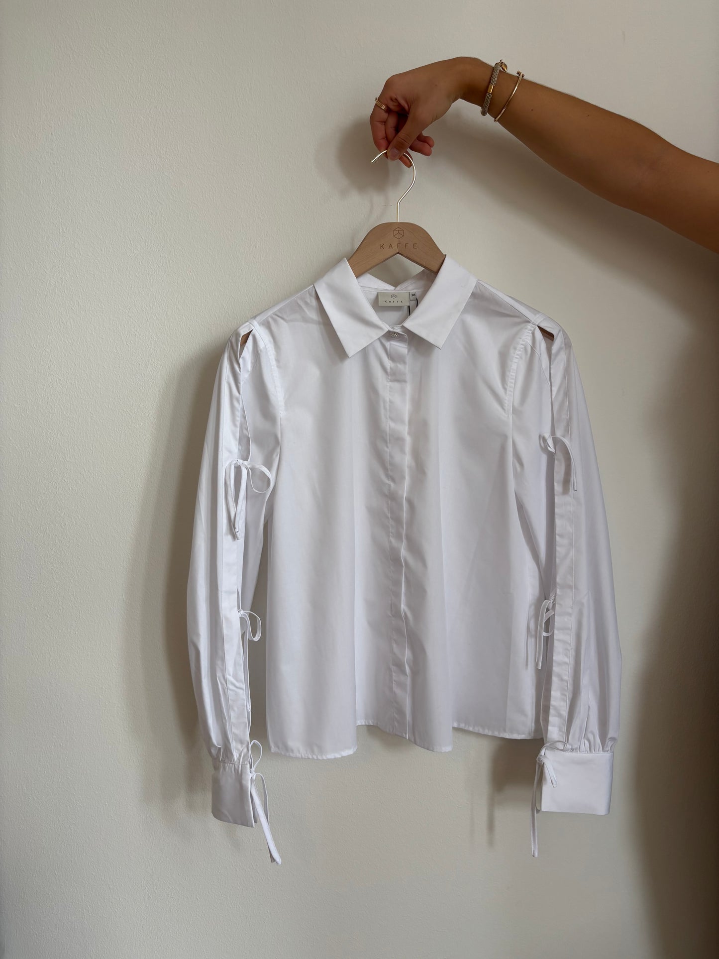 KAFFE SARA Crisp White Tie-Sleeve Blouse – Modern Minimalism with a Soft Feminine Twist